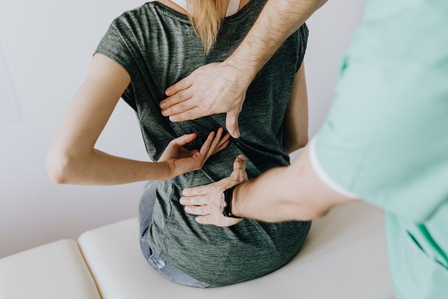 A physiotherapist carrying out a detailed balance and posture assessment
